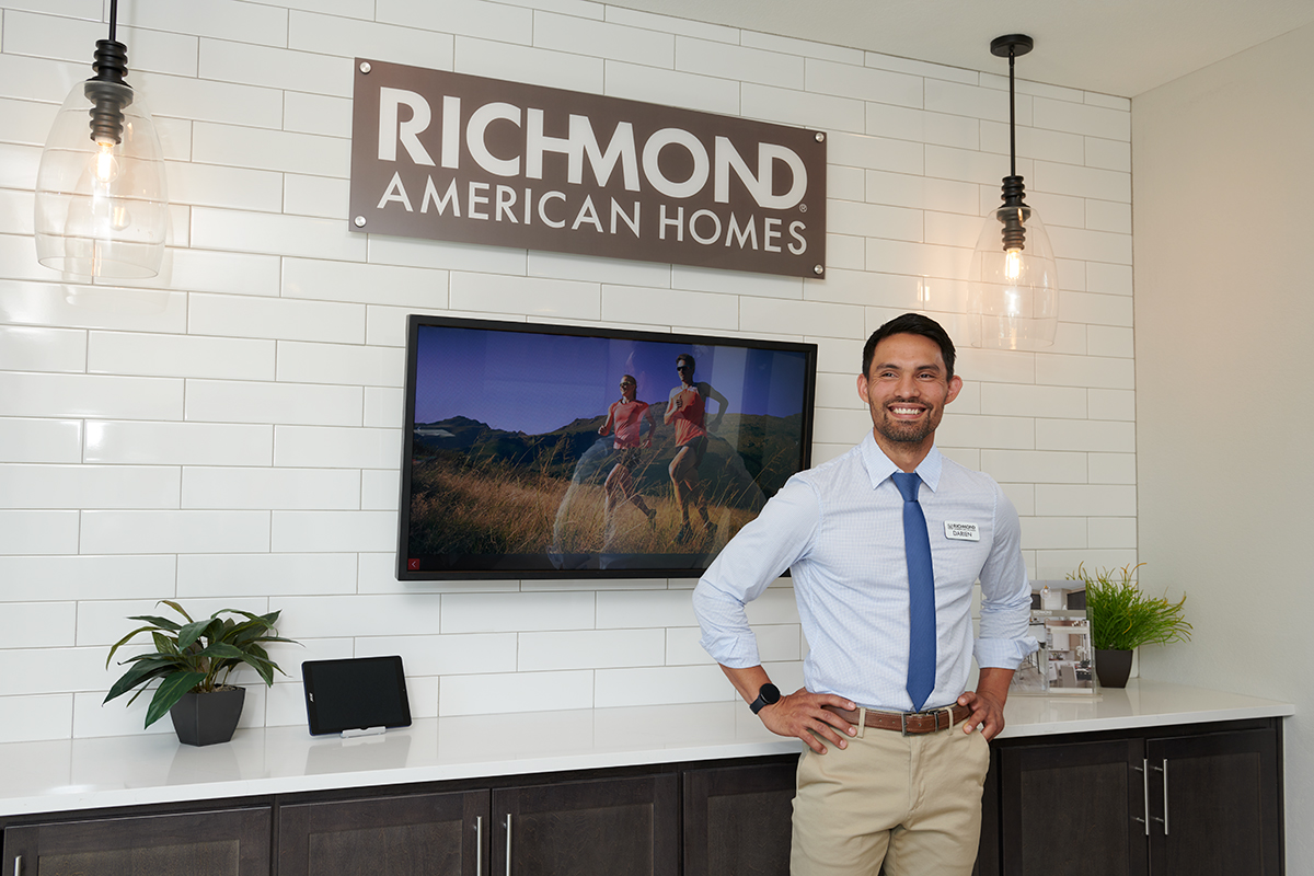 Sales associate standing in model home