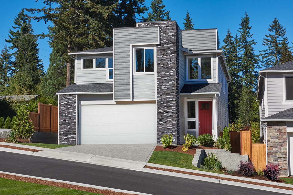 Modern two-story home on a hill with stone accents