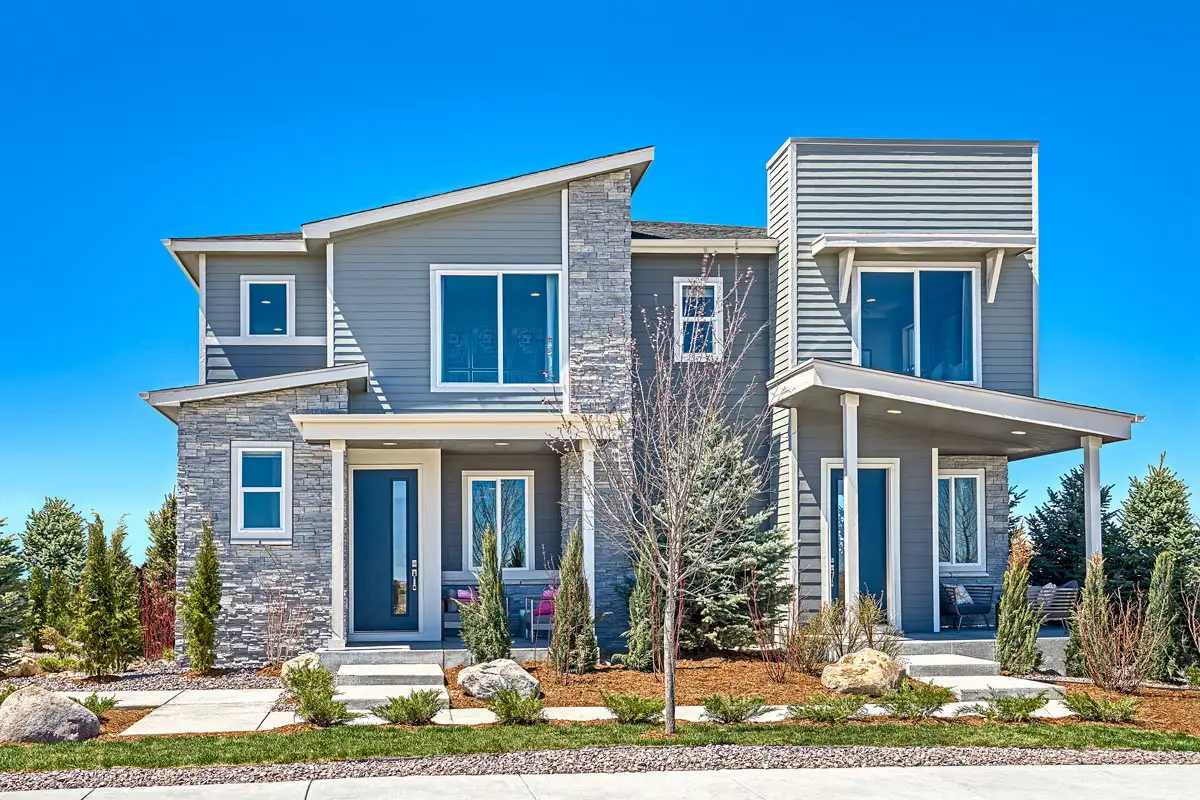 Exterior of Urban Collection home with stone accents and blue front doors