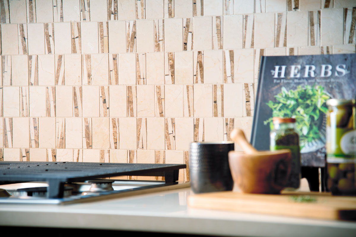 Patterned backsplash behind gas stove