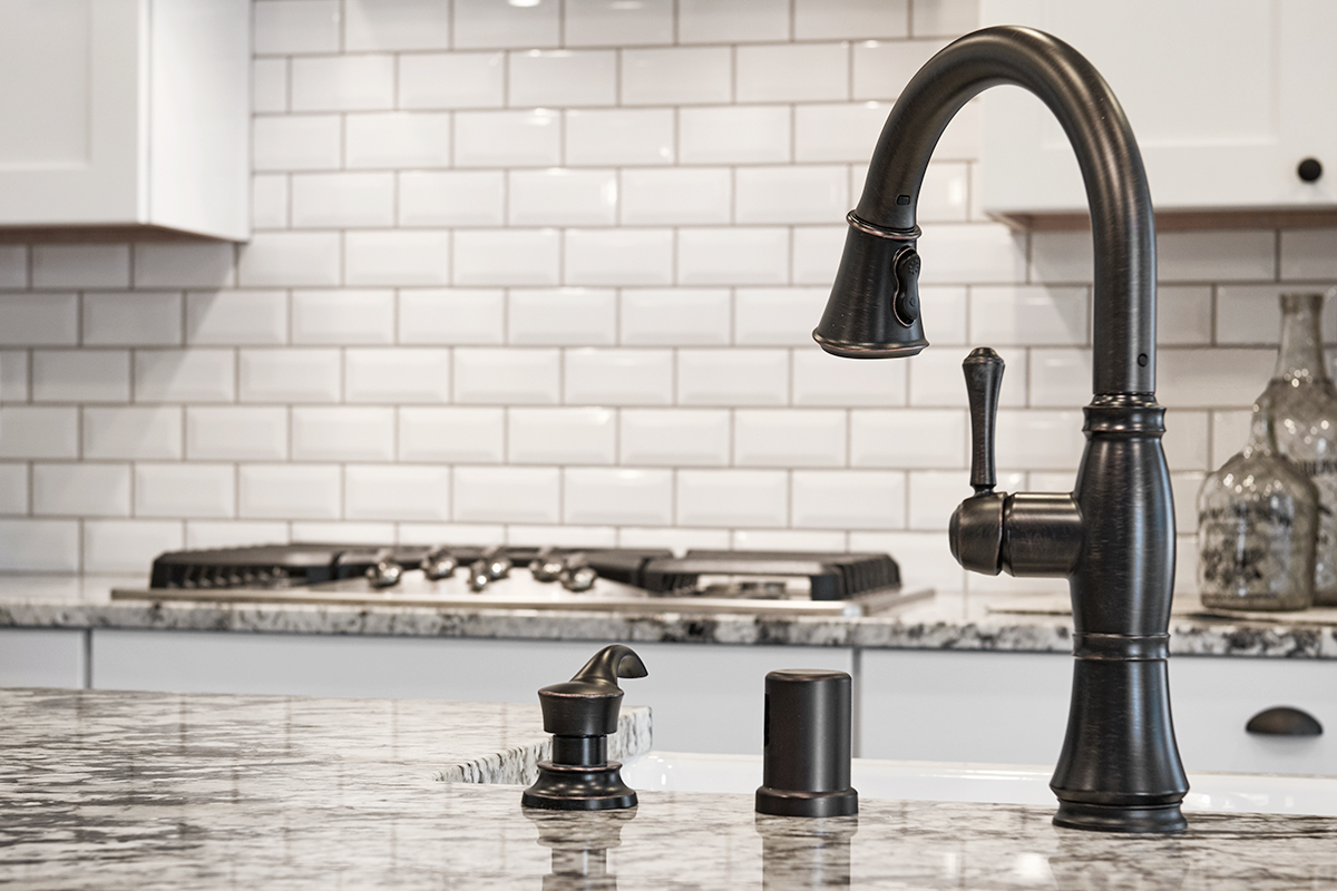 Detail of brushed bronze kitchen sink