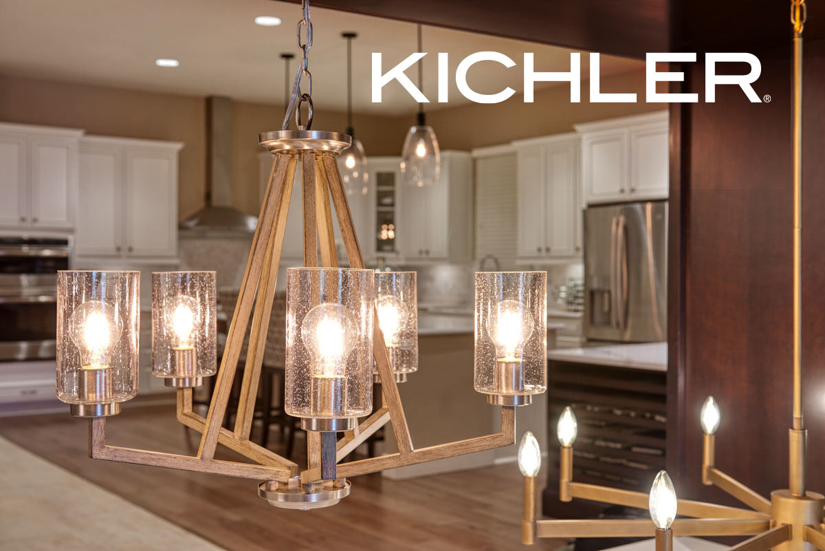 Wooden chandelier with five lightbulbs in glass, with kitchen in the background