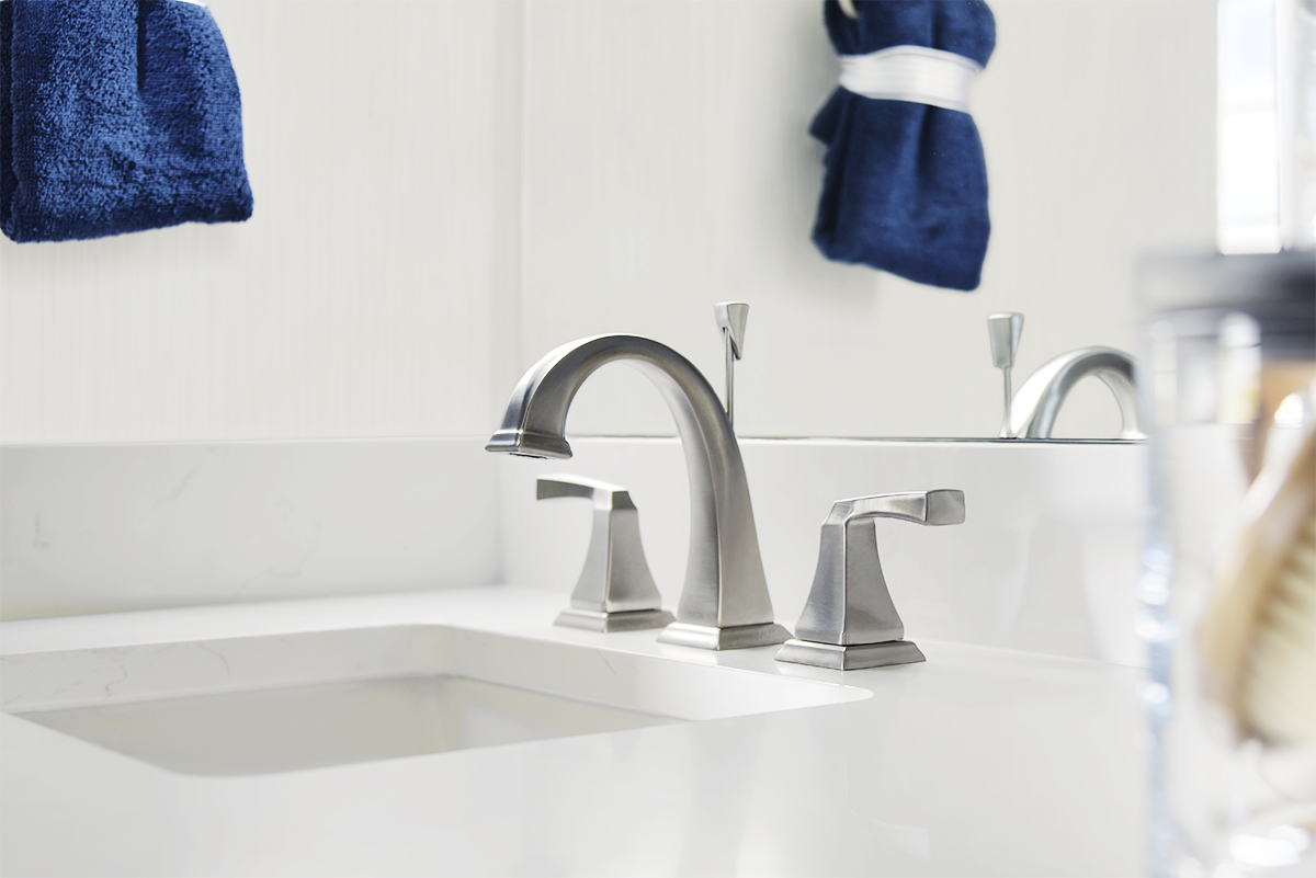 Silver bathroom sink faucet and handles