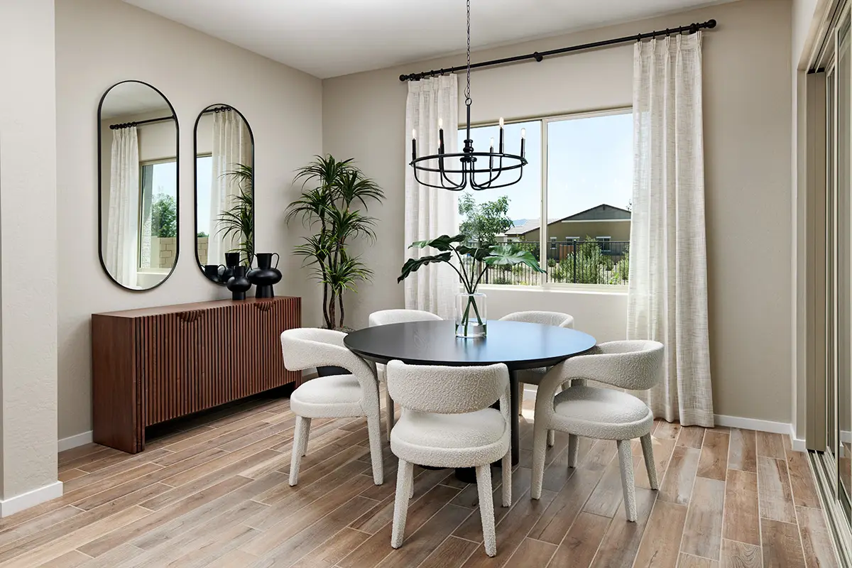 Kitchen nook with round table and white chairs